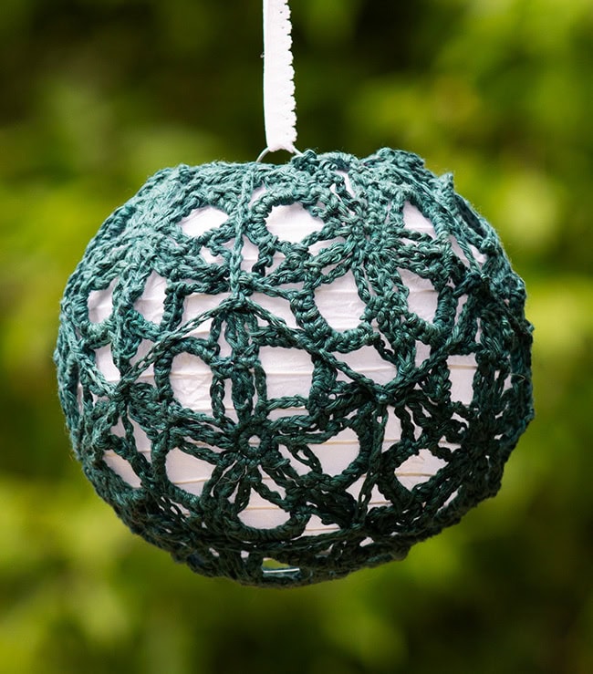 A small lantern worked entirely in teal, using the small motif.